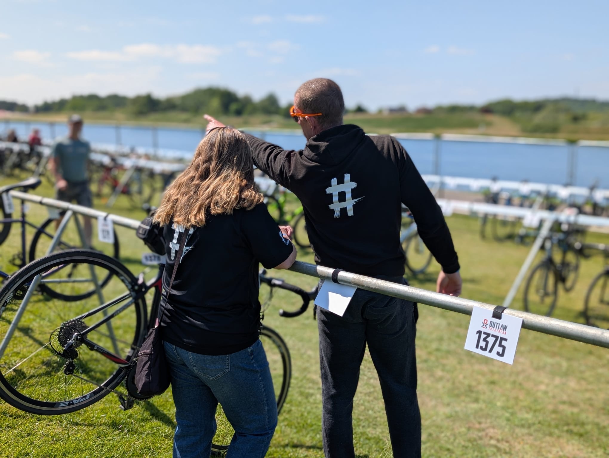 Hashtag Coaching Nick helping an athlete at a triathlon event