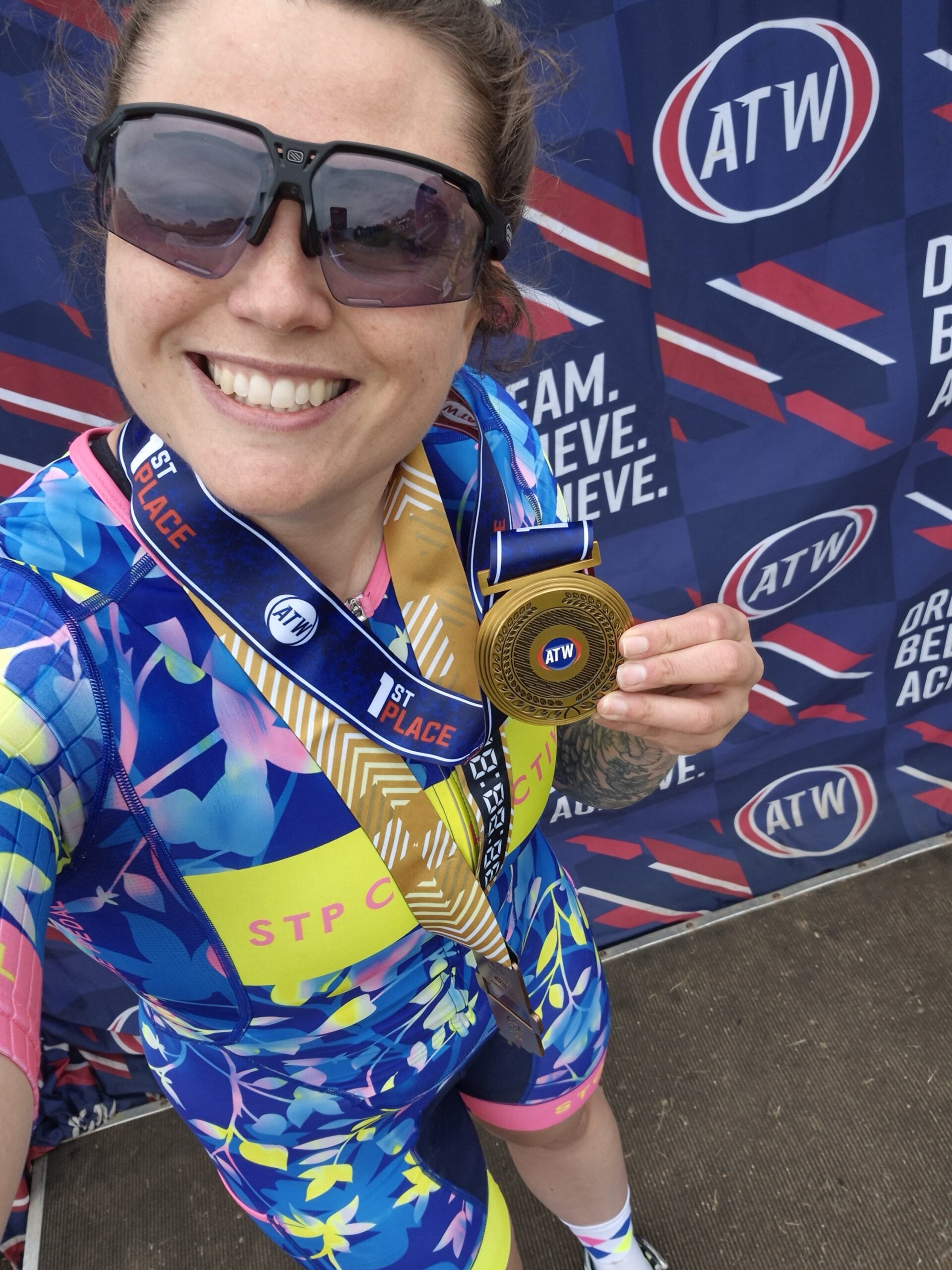 Hashtag Coaching athlete abi posing with a winner medal